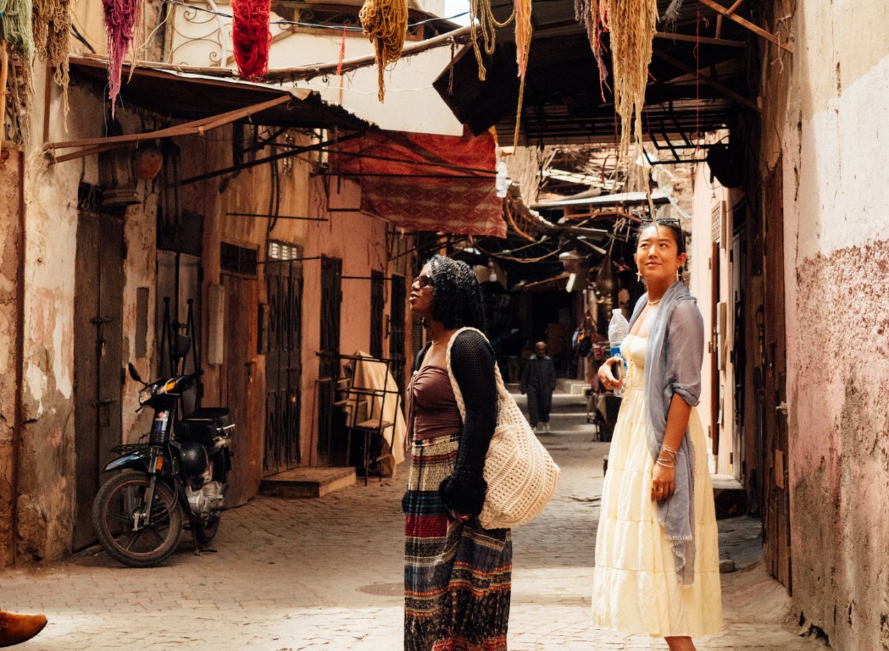 Two young female travellers explore the markets of Morocco and hunt for some gifts to take home