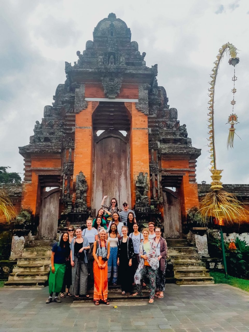 group of travellers in front of Tanah Lot temple Bali