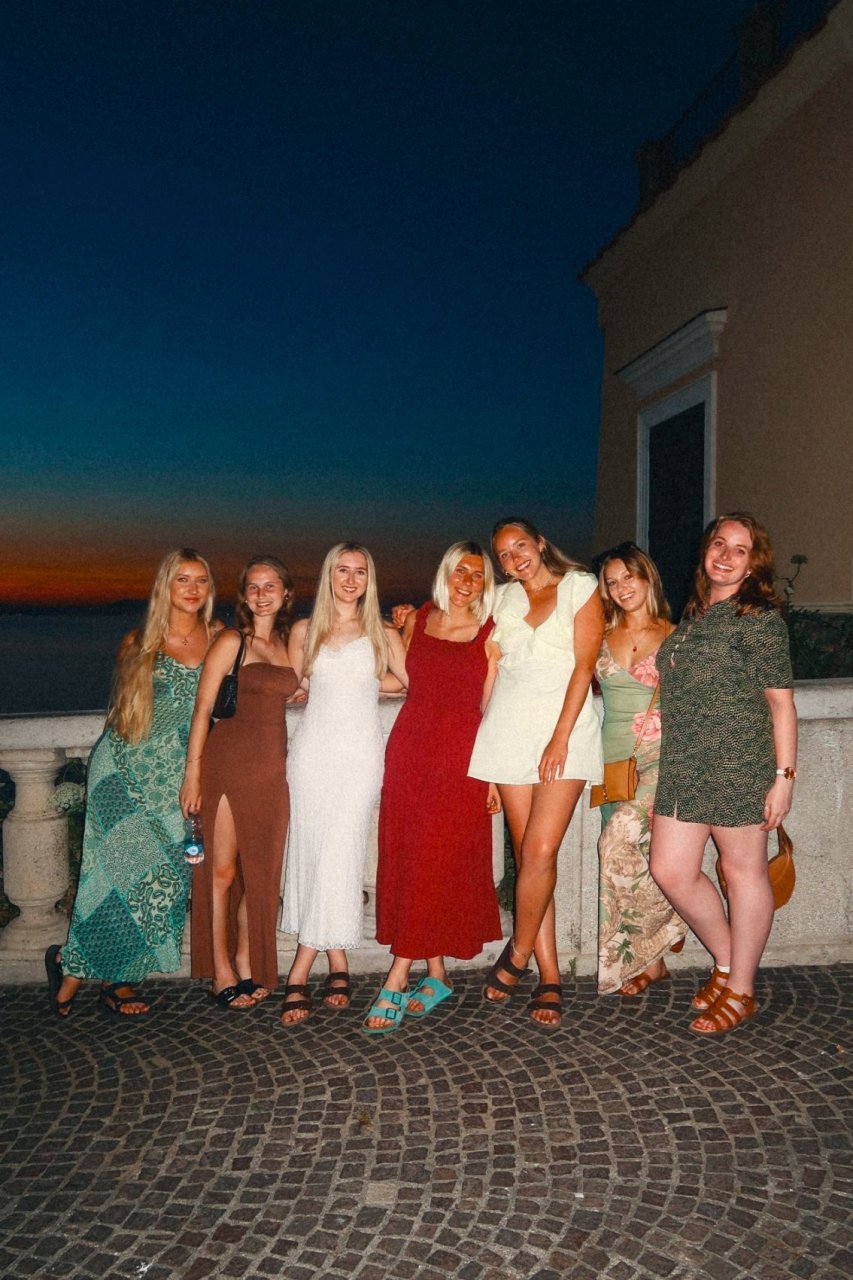A group of young solo travellers on a group tour with TruTravels on an evening out in Italy