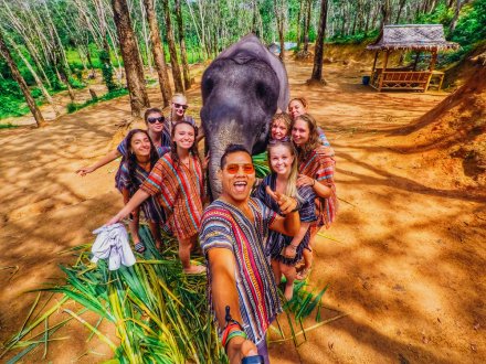 A group selfie with an elephant at the elephant sanctuary in Thailand